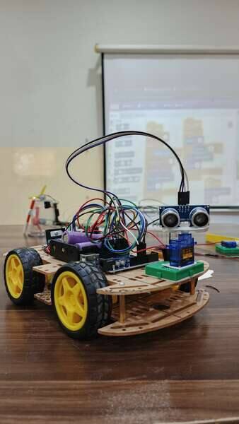 Completed obstacle-avoiding robot with ultrasonic sensor built at a STEMForge robotics workshop