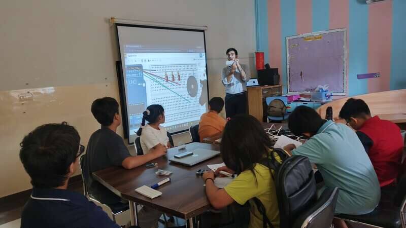 STEMForge instructor teaching Arduino circuit design to students using a projector